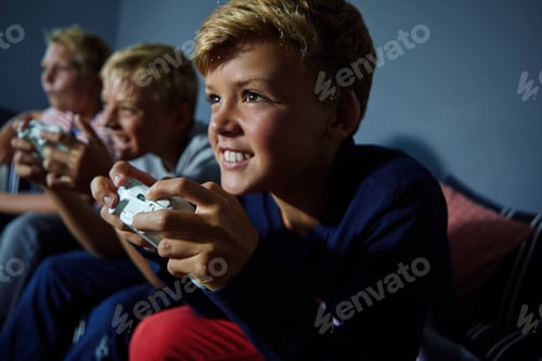 Preview: Gaming, friends and teens on sofa in living room for playing, competition and online entertainment