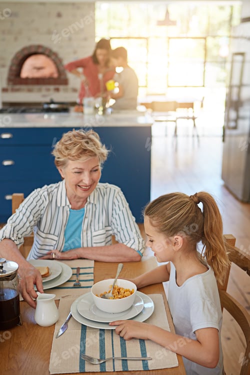 Preview: Grandmother, child and breakfast with cereal for love, wellness or bonding together in home
