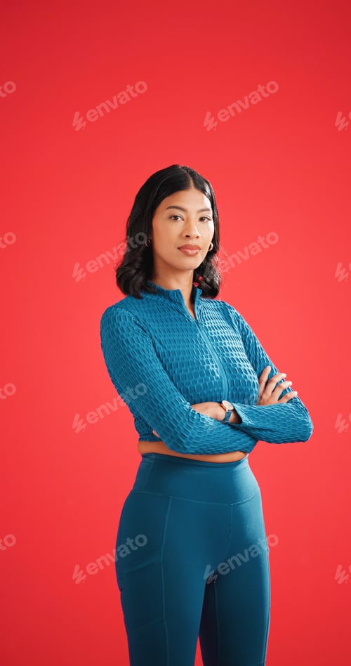 Preview: Serious, athlete and woman with arms crossed in studio, portrait and pride for fitness with workout