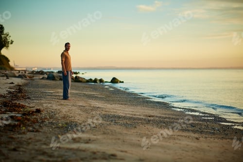 Preview: Break, sky and space with man on beach for holiday, vacation or weekend getaway at coastal location