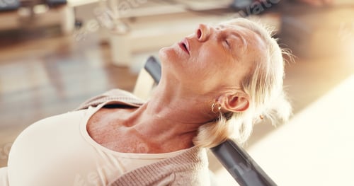 Preview: Break, pilates and reformer with mature woman in studio for exhaustion, fatigue or recovery