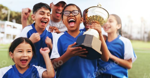 Preview: Excited, coach and children with trophy on field, soccer tournament success and celebration victory