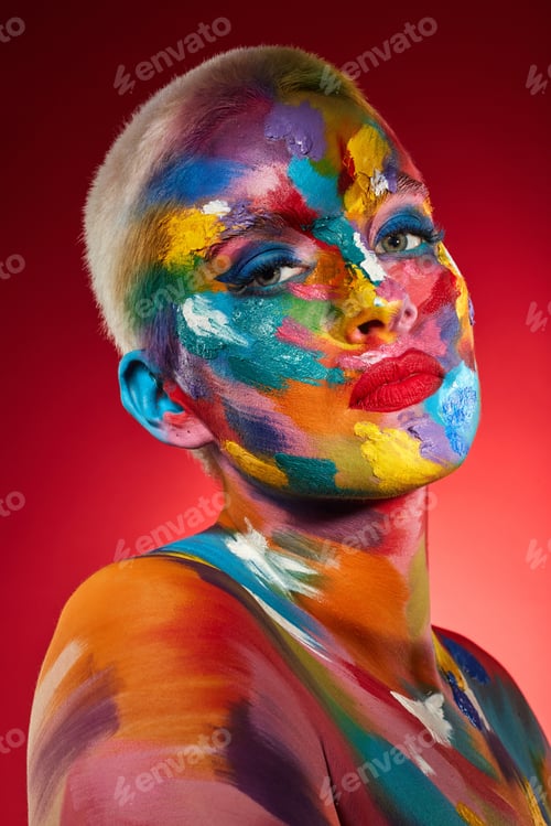 Preview: Woman, face paint and rainbow with portrait in studio for texture, art deco