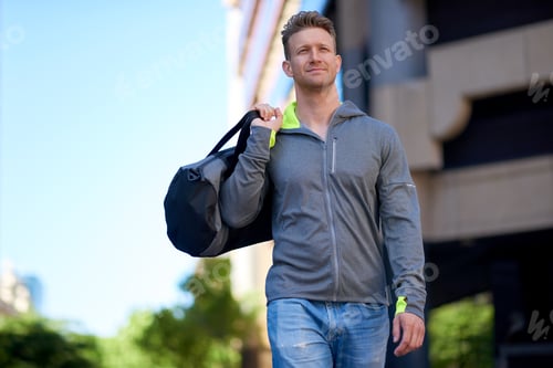 Preview: Man, fitness and walking with gym bag in city for workout equipment or outdoor preparation