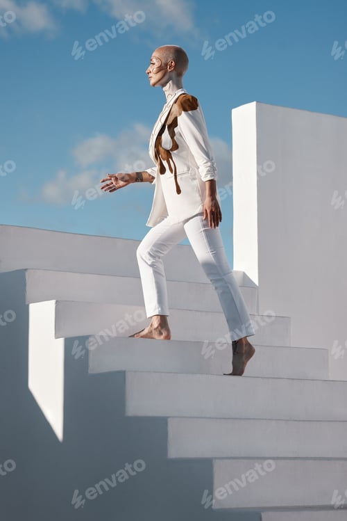 Preview: Creative, woman and fashion on stairs with makeup, avant garde outfit or walk for self discovery