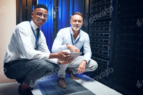 Preview: Men, tablet and team with smile in server room with cybersecurity, problem solving or collaboration