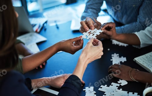 Preview: Hands, team and puzzle at office meeting for synergy, problem solving or collaboration at insurance