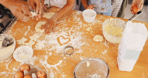 Preview: Baking, hands and heart with family in kitchen in home for support, cookies and bonding together