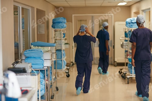 Preview: Surgeon, people and walking in hospital with scrubs for medical emergency, operation and procedure