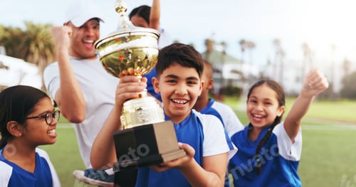 Preview: Happy, coach and children with trophy on field, soccer tournament success and celebration victory