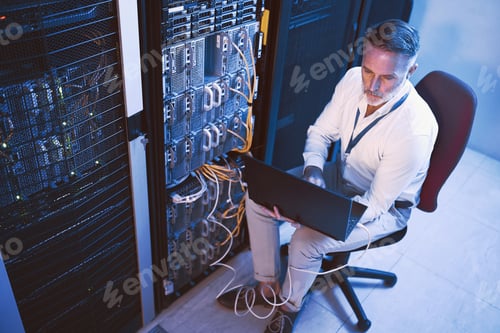 Preview: Engineer, reading and man with laptop in server room, online and troubleshooting for system upgrade