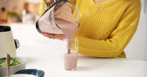 Preview: Pouring, smoothie and hands with blender, kitchen and healthy drink for nutrition boost and protein