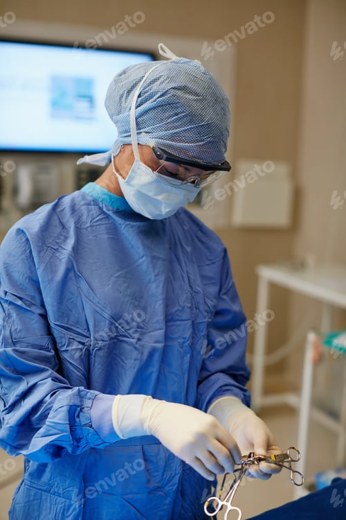 Preview: Healthcare, preparation and surgical scissors with doctor in operating room for procedure