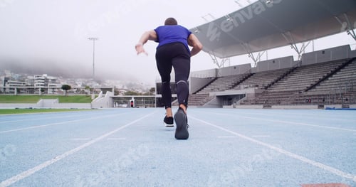 Preview: Man, back or runner with start on stadium track for sport race, sprint or fitness training