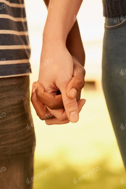 Preview: Holding hands, love and couple in nature with bonding, romance or marriage together in park