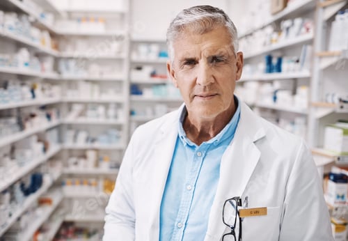 Preview: Serious, pharmacy and portrait of mature man at dispensary with confidence for healthcare career
