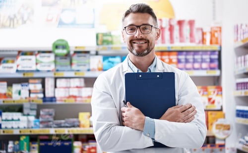 Preview: Pharmacist, man or happy with clipboard in store for inventory control, stock management or pride