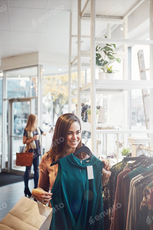 Preview: Shopping, clothes and smile with woman in store for retail option, fashion decision