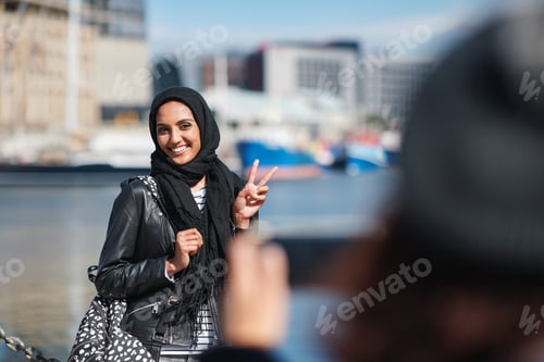 Preview: Travel, happy and muslim woman with photography in city for memory on vacation, getaway or holiday
