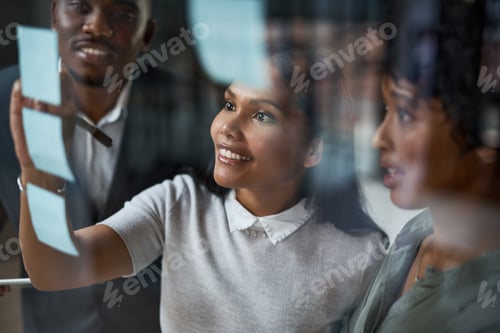 Preview: Woman, sticky note and team by glass wall in office with writing, planning