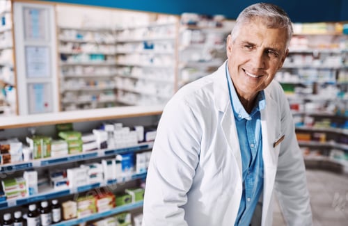 Preview: Smile, man and pharmacist thinking with medicine. wellness and drugs for healthcare