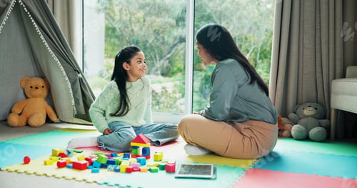 Preview: Mother, girl and learning with blocks in home, happy or bonding with talk on floor for development