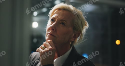 Preview: Night, thinking and mature woman in office with project, business plan and brainstorming at digital