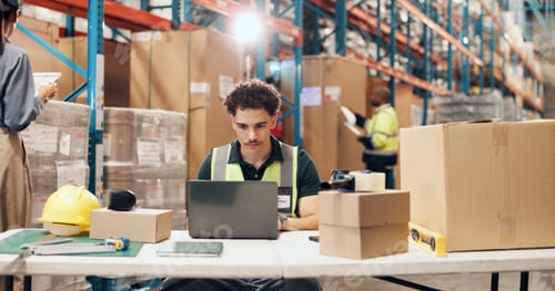 Preview: Logistics, man and typing on laptop in warehouse for order tracking, shipping status