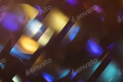 Preview: Abstract light patterns with vibrant colors and reflections creating a dynamic visual effect on a da