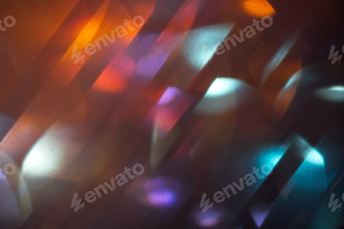 Preview: Abstract light reflections with colorful bokeh effects creating a dynamic visual pattern on a dark b