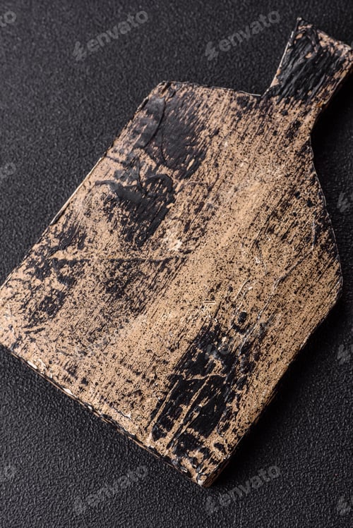 Preview: An empty wooden cutting board, kitchen utensils for food preparation. An empty cutting board