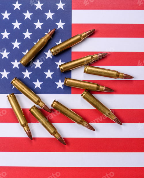 Preview: Assault rifle cartridges on the US flag, serving as a conceptual backdrop for defense