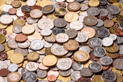 Preview: A background of silver, gold, and copper coins of various denominations. Metal coins