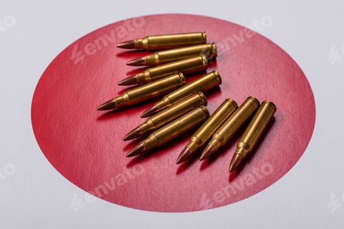Preview: Assault rifle cartridges on the Japanese flag, serving as a conceptual backdrop for defense