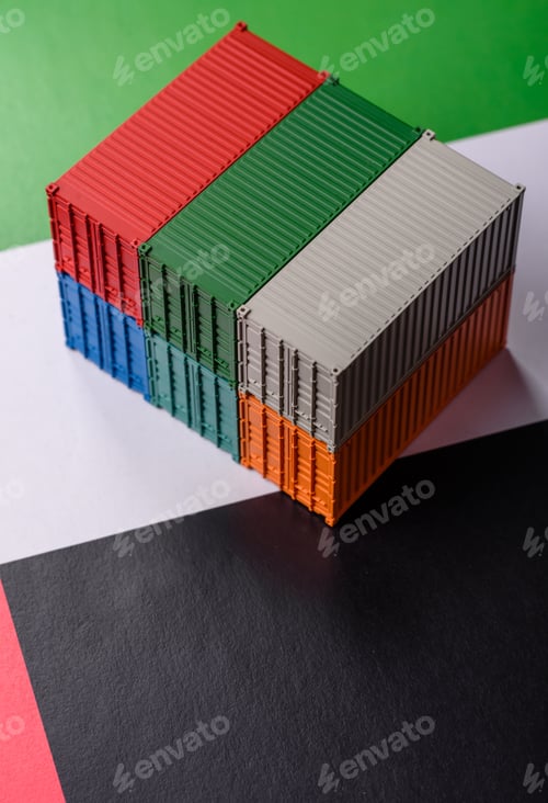 Preview: Cargo containers on the UAE flag as a conceptual backdrop for goods export. Cargo containers