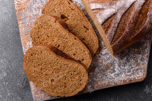 Preview: A loaf of homemade whole grain rye bread for the dinner table. A loaf of rye bread