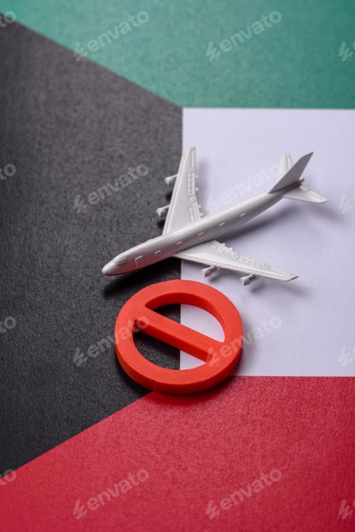Preview: A mock up of airplane surrounded by no fly signs on a Kuwaiti flag