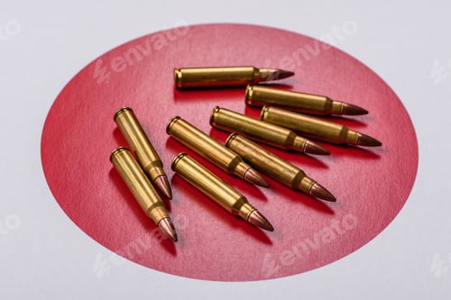 Preview: Assault rifle cartridges on the Japanese flag, serving as a conceptual backdrop for defense