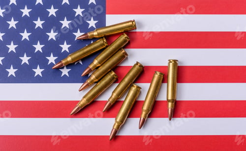 Preview: Assault rifle cartridges on the US flag, serving as a conceptual backdrop for defense