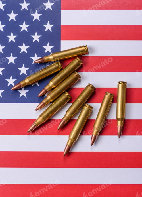 Preview: Assault rifle cartridges on the US flag, serving as a conceptual backdrop for defense