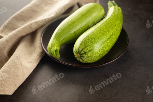 Vista previa: Fresh young zucchini on Dark Table - Summer Harvest