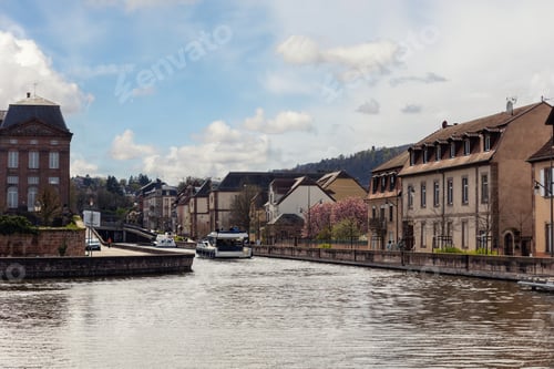 Preview: Saverne canal historic Alsace town pastel houses stone embankment sightseeing boat moving calm water