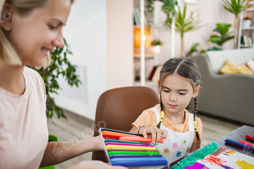Preview: Mother and daughter engage in creative painting at home on a sunny afternoon