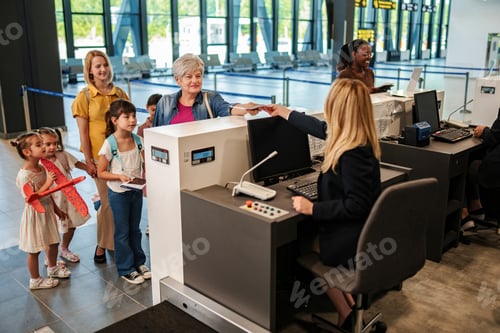 Preview: Multi-generational family checking in at airport for vacation trip