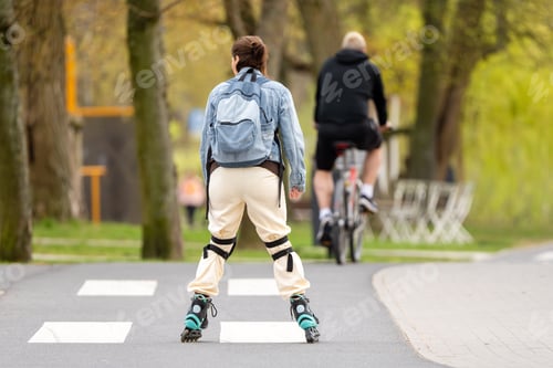 Preview: Woman Rollerblading Down Path