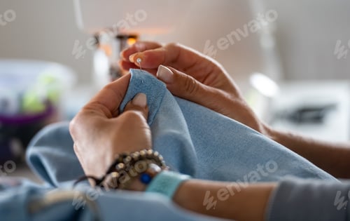 Preview: Woman Pinning Edge Of Fabric