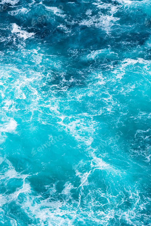 Preview: Abstract background of beautiful blue and turquoise ocean waves. Vertical photo.
