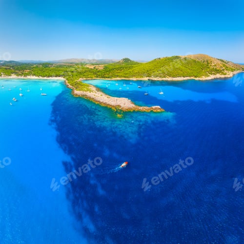 Preview: Aerial view of Cala Agulla beach and turquoise bay with boats in Mallorca. Scenic Balearic Islands