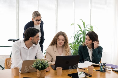 Preview: Business professionals collaborating on project planning in office