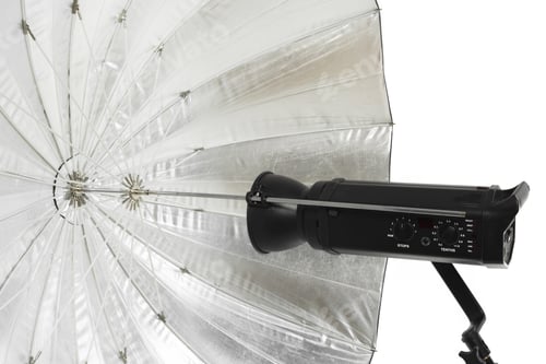 Preview: Lighting equipment used for studio photography with umbrella and flash attached